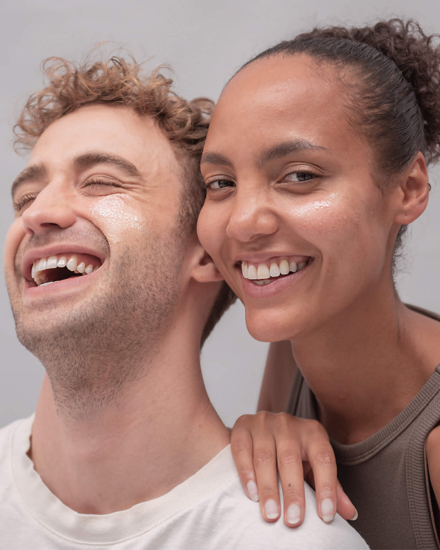 Boy and girl applying skincare 